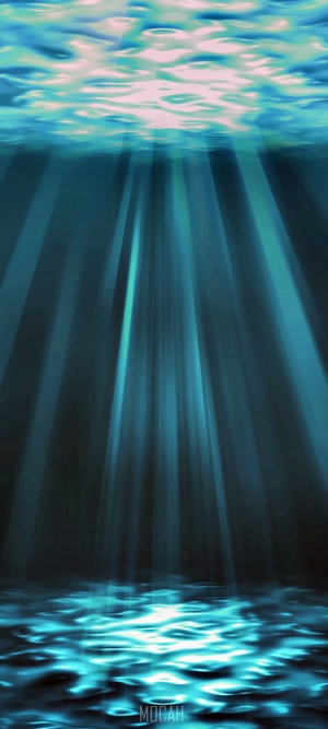 Underwater scene with sunbeams and rippling water