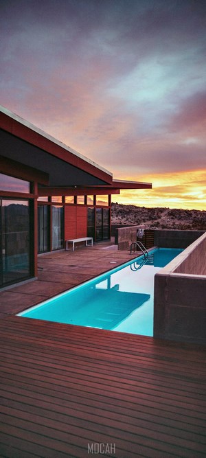 Modern House with Swimming Pool at Sunset