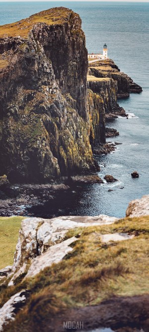 Neist Point Lighthouse on a rocky cliff overlooking the sea