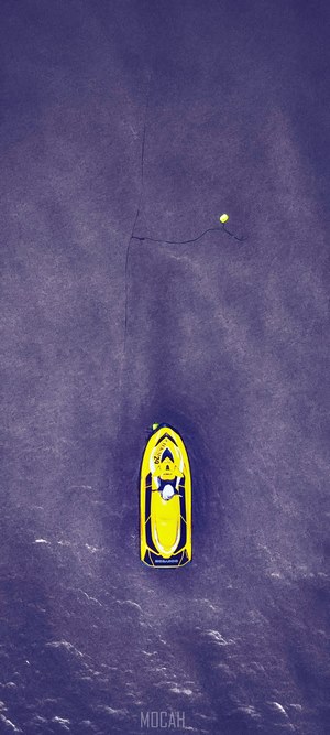 Yellow jet ski on dark water