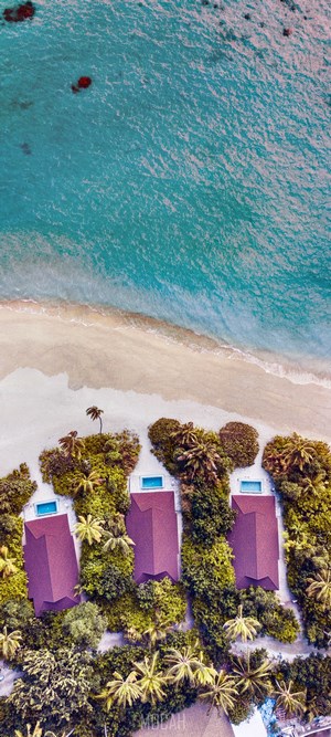 Aerial view of tropical resort with turquoise ocean