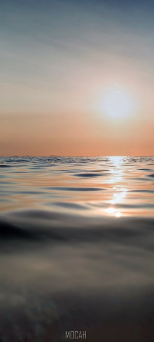 Sunset over the ocean with ripples