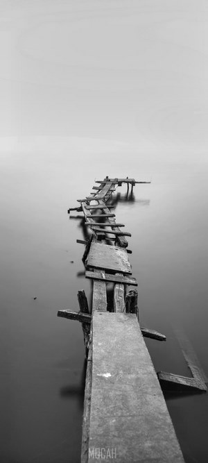 Monochrome Crooked Jetty Over Calm Lake