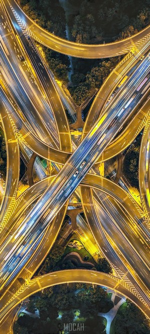 Aerial view of a complex highway interchange at night