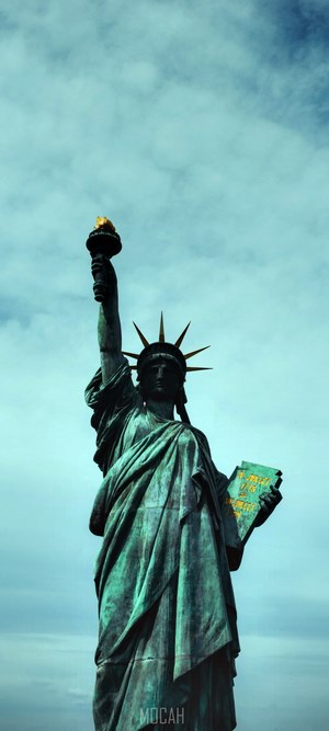 Statue of Liberty against a cloudy sky
