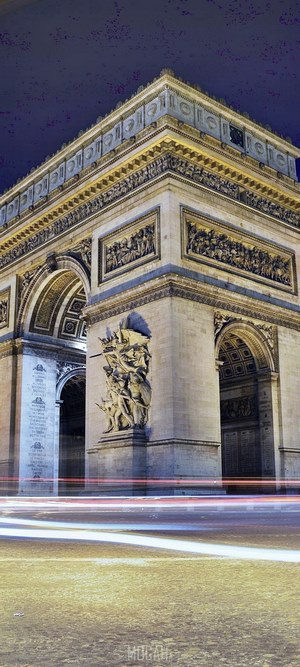 Arc de Triomphe at night with light trails