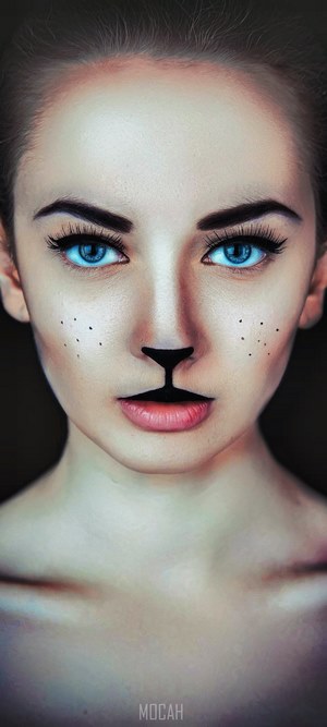 Girl with Cat-Inspired Makeup and Intense Blue Eyes