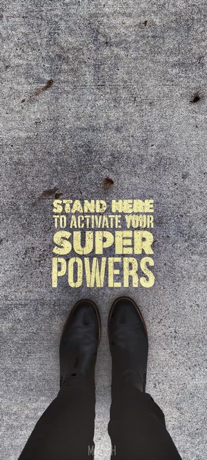 Text on concrete: Stand here to activate your superpowers