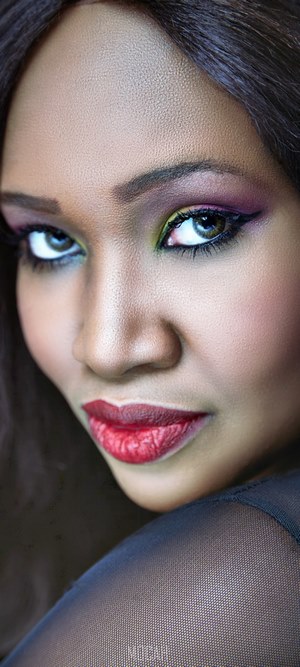 Woman portrait with colorful eye makeup and red lipstick