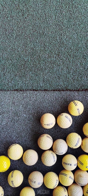 Golf balls on a green surface