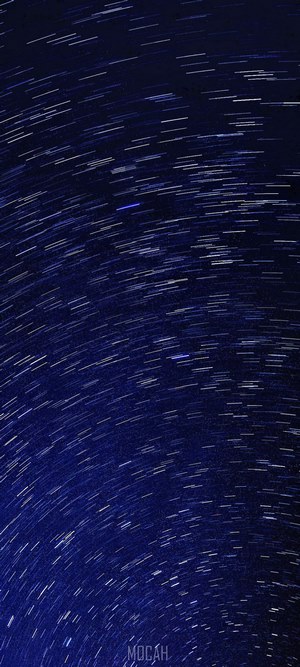 Star trails over dark blue night sky