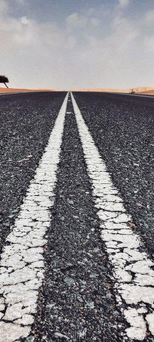Desert road with double white lines