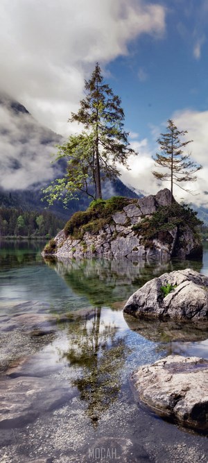 Tranquil Lake with Rocky Isla and Reflected Trees