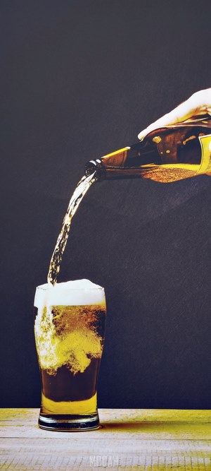 Beer pouring into a glass