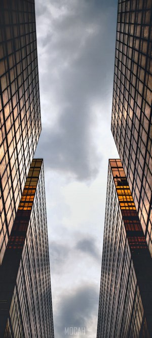 Two skyscrapers against a cloudy sky
