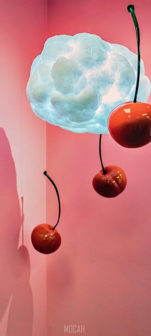 Cherries hanging from a cloud lamp
