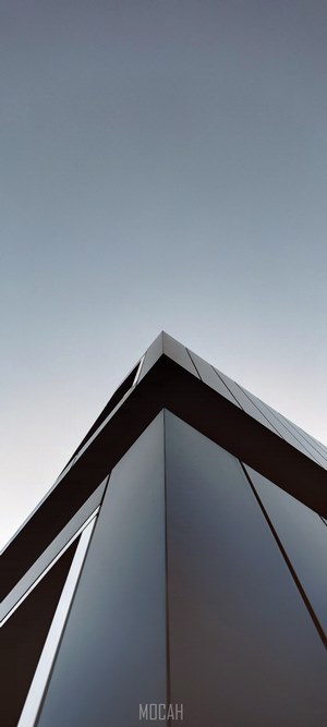 Modern building corner against clear sky