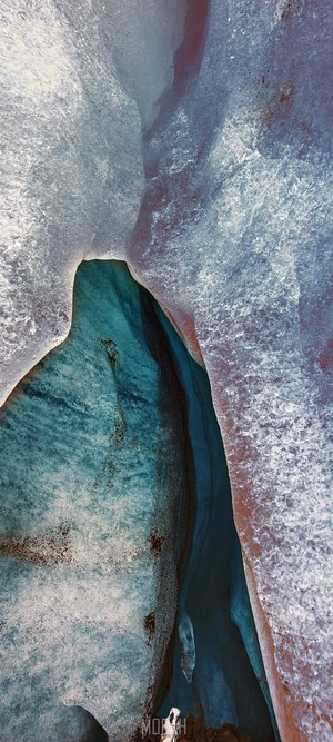 Ice cave with blue water