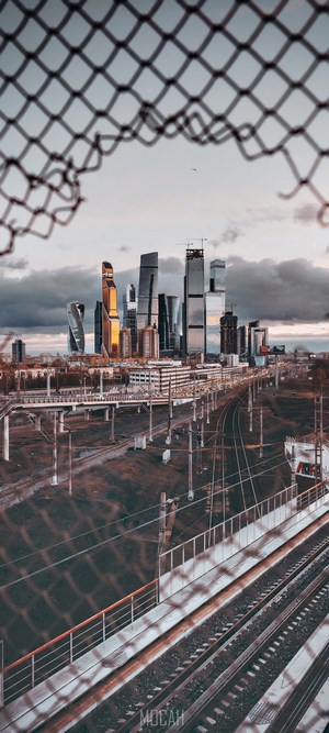 Moscow cityscape with skyscrapers and railway tracks