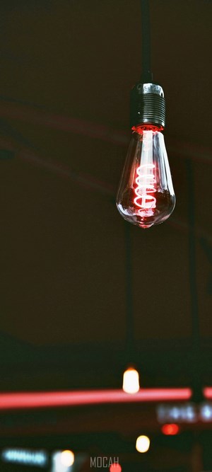 Red glowing Edison light bulb hanging