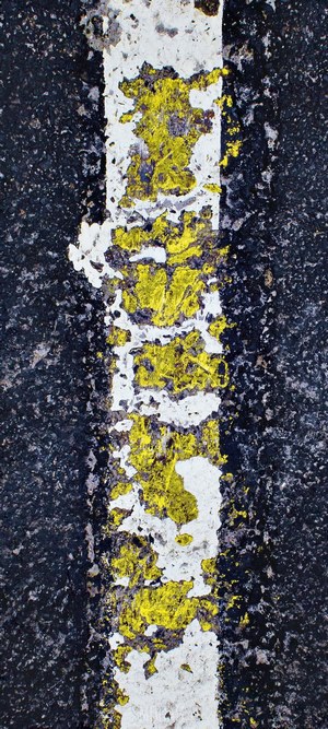 Close-up of a worn road marking