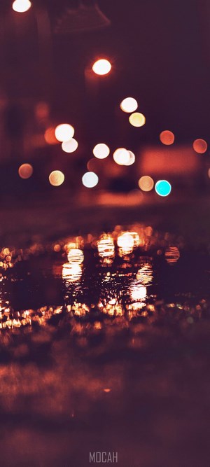 Bokeh lights reflected on wet surface