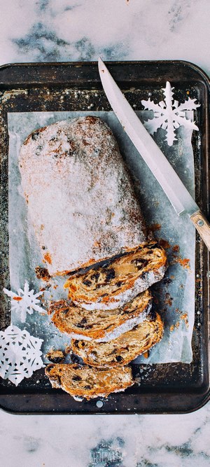 Slices of Christmas Stollen with powdered sugar