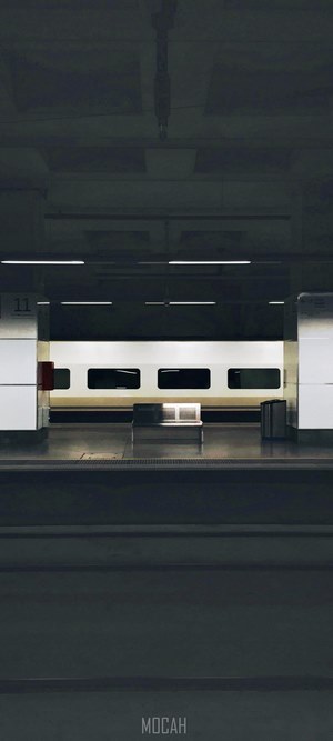 Train at a dark railway station platform