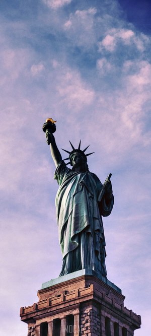 Statue of Liberty against a cloudy sky