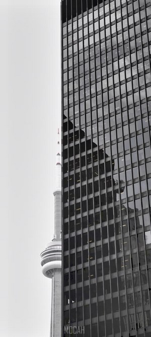 CN Tower reflected in a modern skyscraper