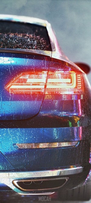 Close-up of a blue car's rear lights in the rain