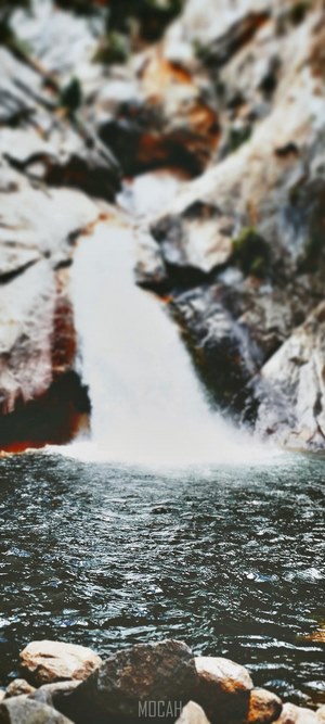 Waterfall cascading into a rocky pool