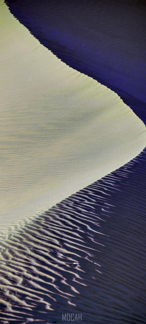 Sand dune with ripples and shadows