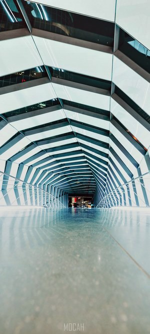 Modern architectural tunnel with reflective floor