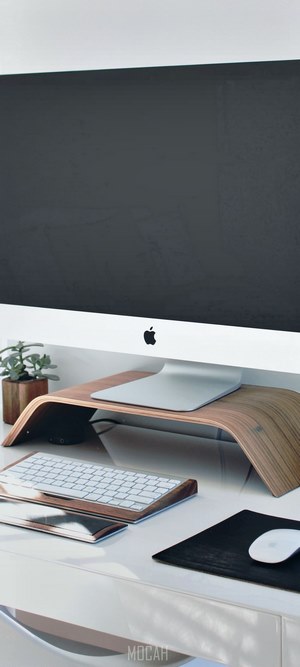 iMac desk setup with wooden accessories