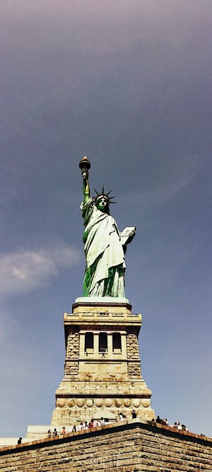 Statue of Liberty against a cloudy sky