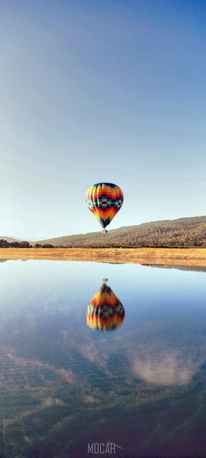 Hot air balloon reflected in water