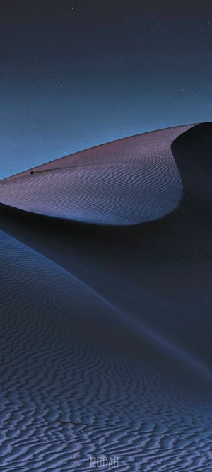 Night desert dunes under starry sky
