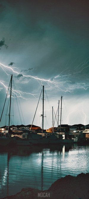 Boats and lightning over water