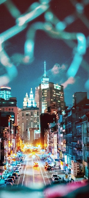Nighttime Cityscape with Tall Buildings and Traffic