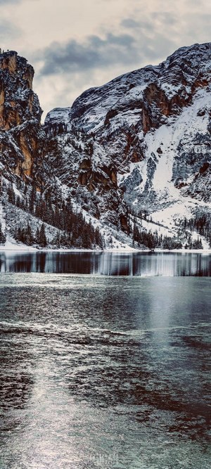 Snowy Mountains and Frozen Lake