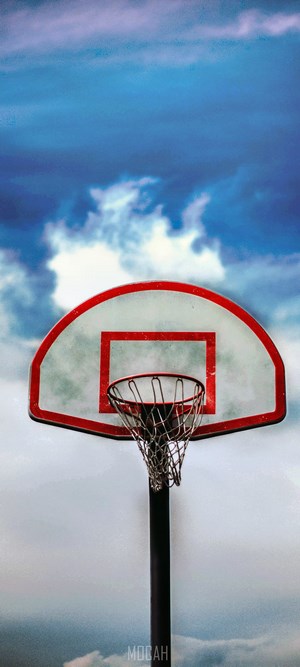 Basketball hoop against a cloudy sky