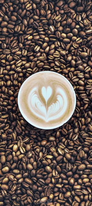 Latte art heart on coffee beans