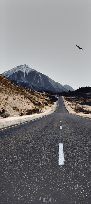 Empty road leading to a mountain in Arthur's Pass