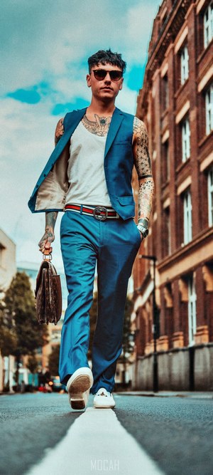 Man in blue suit walking in London