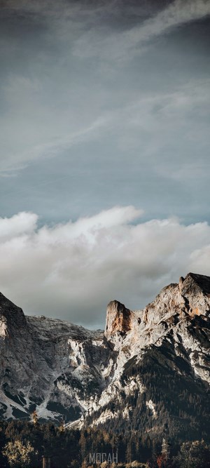 Mountain range with clouds and trees