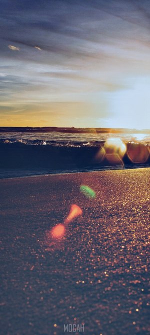Sunset over the ocean with lens flare