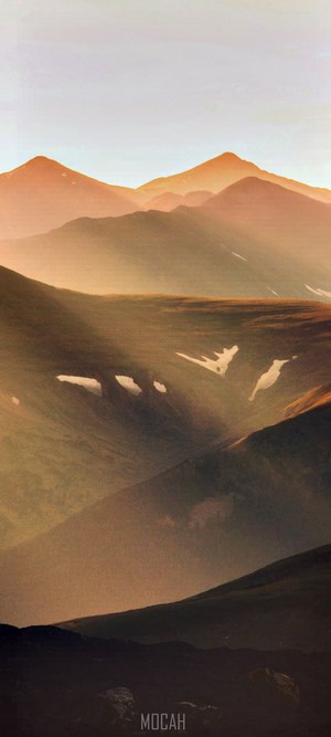 Mountain range at sunset with haze