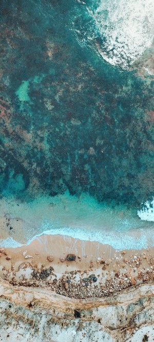 Aerial view of a rocky beach and ocean waves