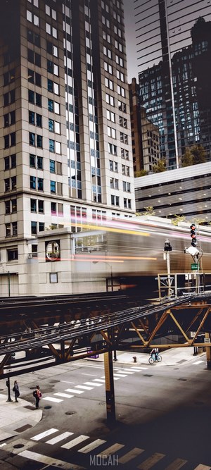 Elevated train passing buildings in a city